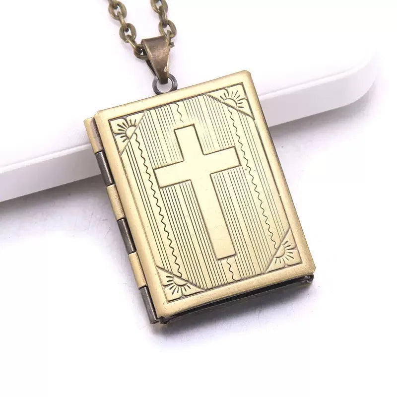 Front view of personalized silver cross locket necklace