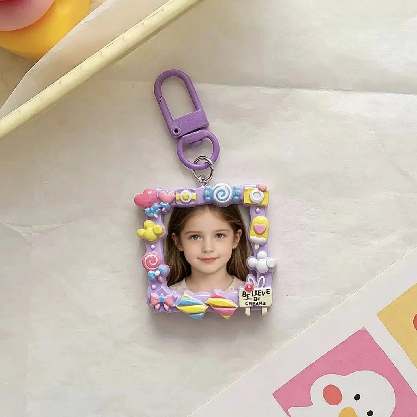 Personalized baby photo keychain with colorful handmade-style picture frame.