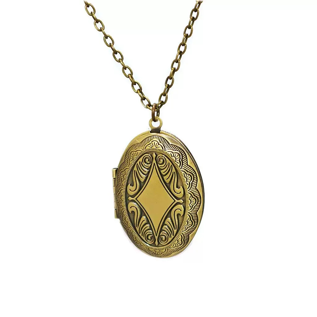 Closed vintage oval personalized photo locket necklace with a classic antique silver design.