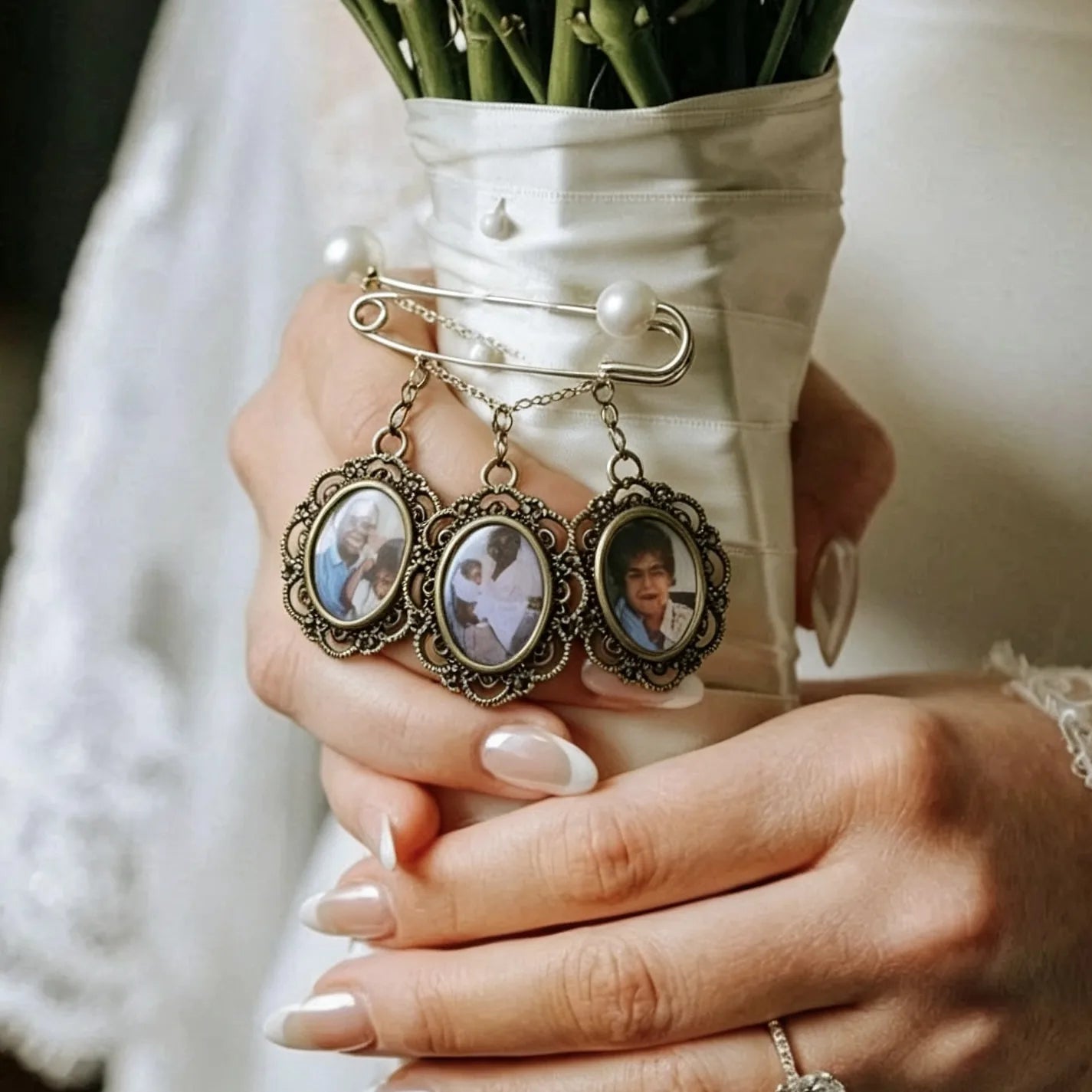 Elegant personalized photo charms displayed on a wedding bouquet memory brooch for brides.