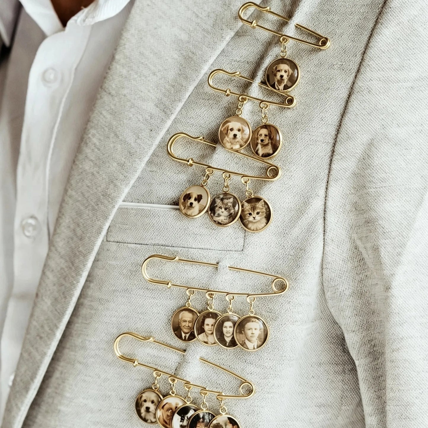 Close-up of handcrafted custom photo charms on a personalized wedding memory brooch.