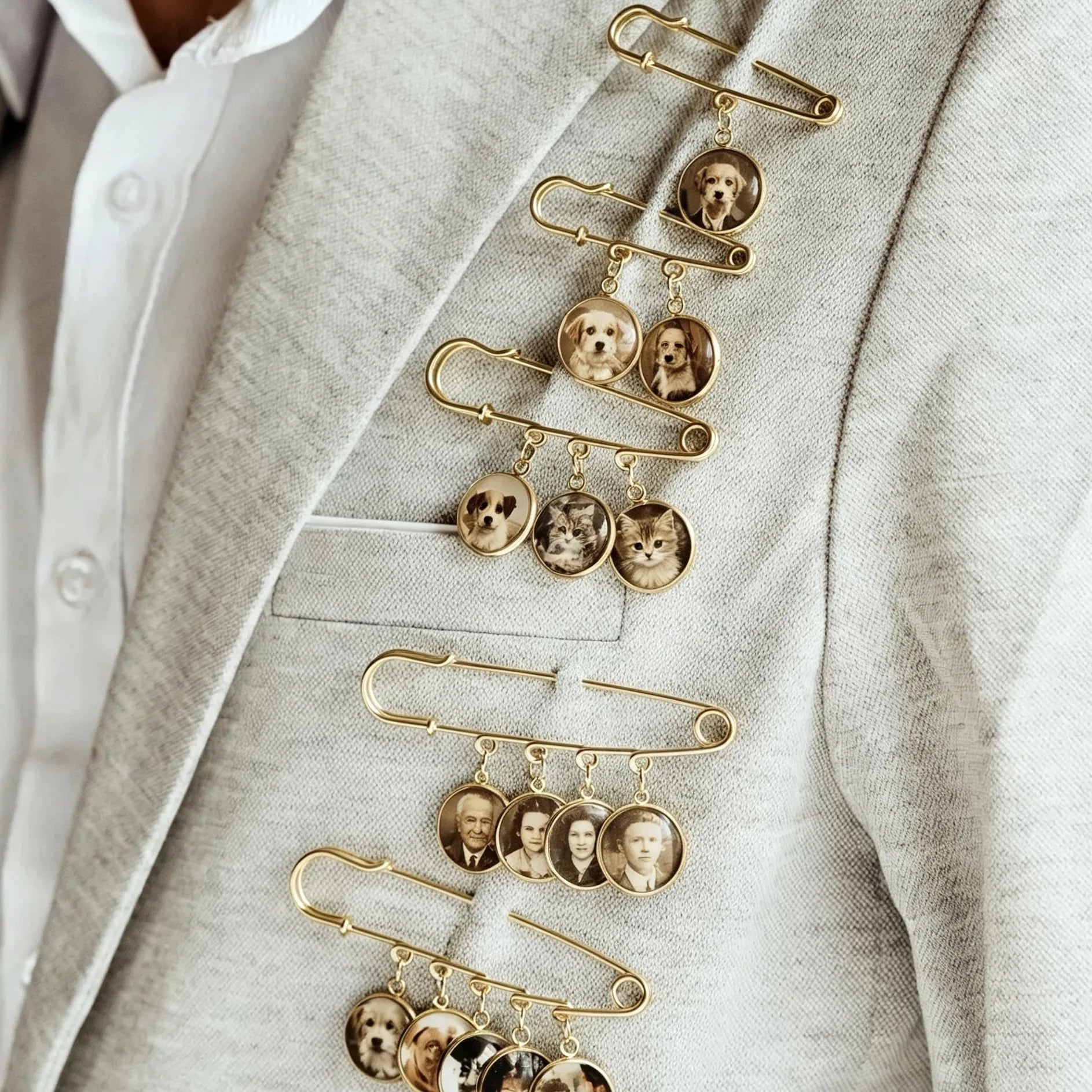 Close-up of handcrafted custom photo charms on a personalized wedding memory brooch.