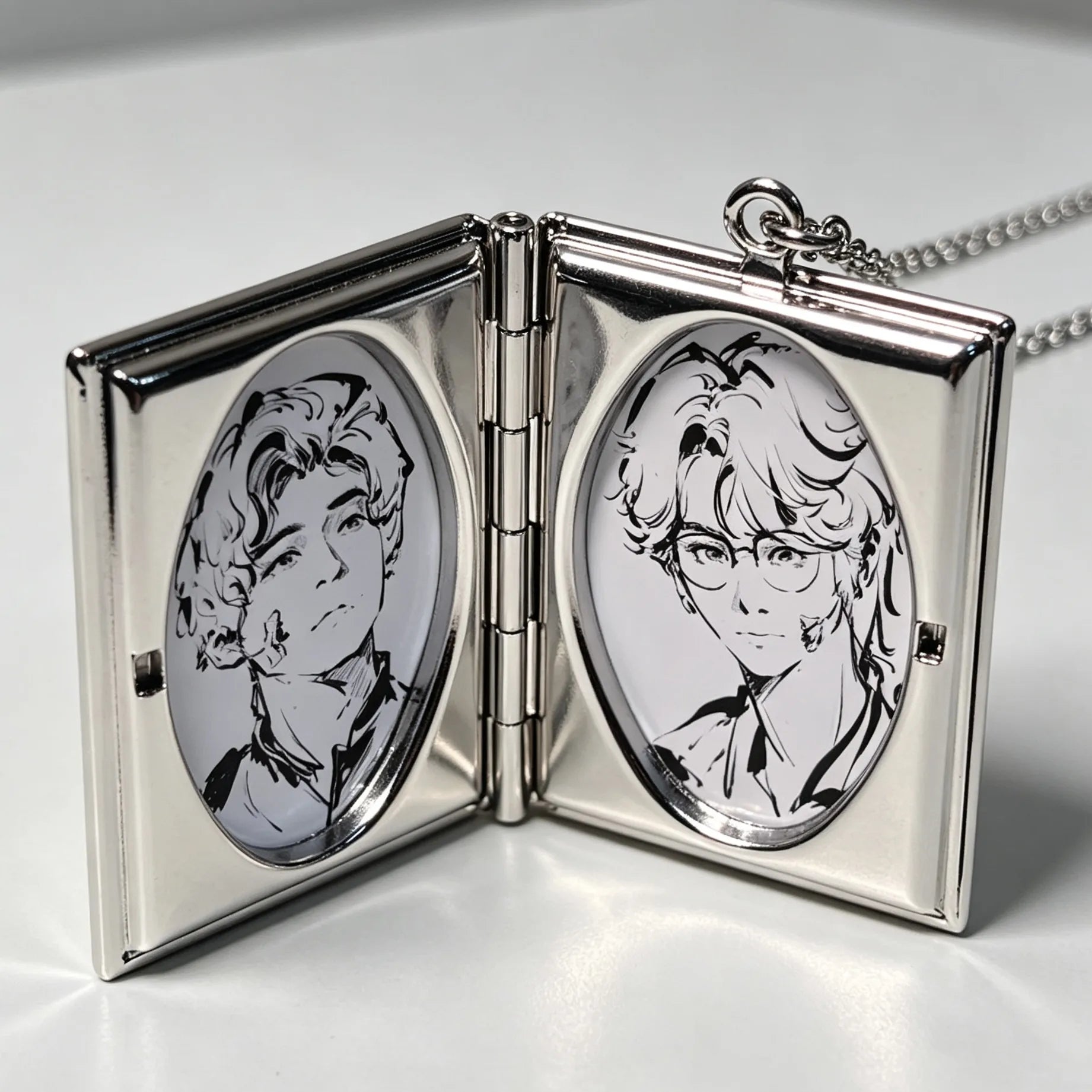 Open personalized photo locket necklace displaying two custom portrait photos inside the pendant.