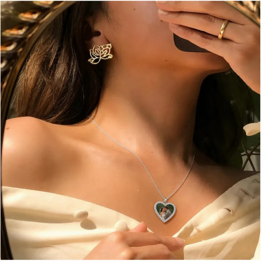 Personalized heart photo necklace worn on neck, elegant custom jewelry accessory for women.