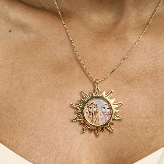 Woman wearing personalized gold sun photo necklace with custom picture pendant.