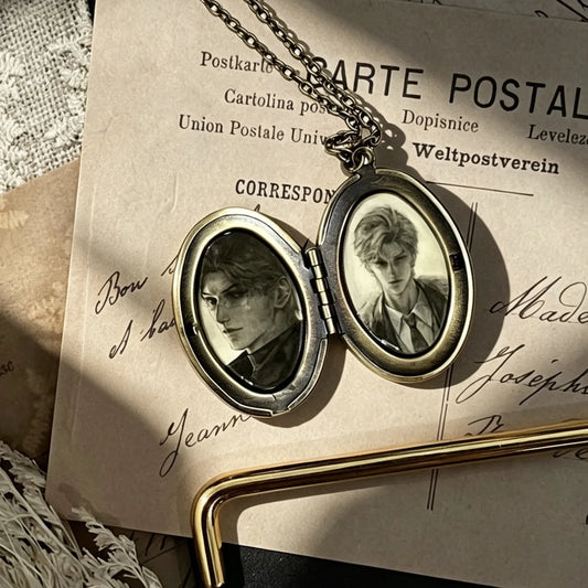 Personalized vintage oval photo locket necklace opened to display two custom photos inside a timeless keepsake pendant.
