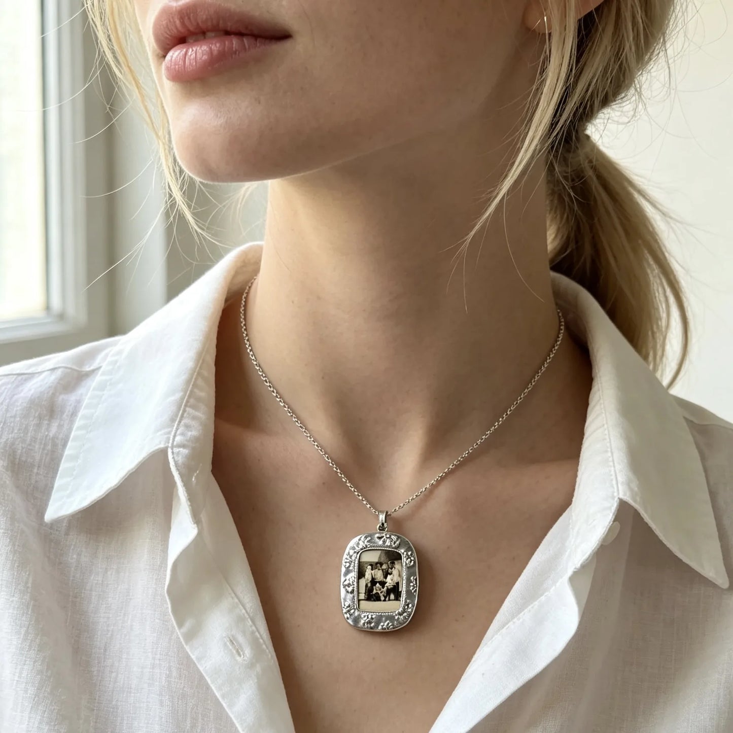 Personalized vintage photo frame necklace featuring a custom family picture in an elegant silver pendant.
