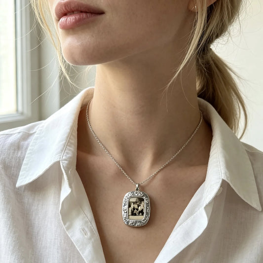 Personalized vintage photo frame necklace featuring a custom family picture in an elegant silver pendant.