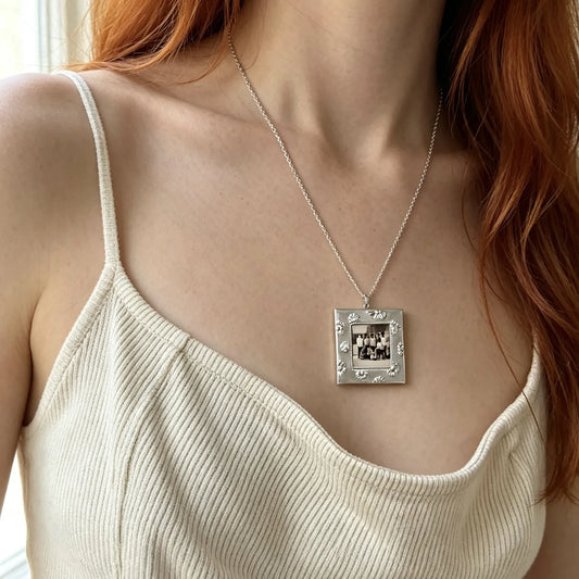 Woman wearing a personalized vintage square photo frame necklace with a custom family picture.