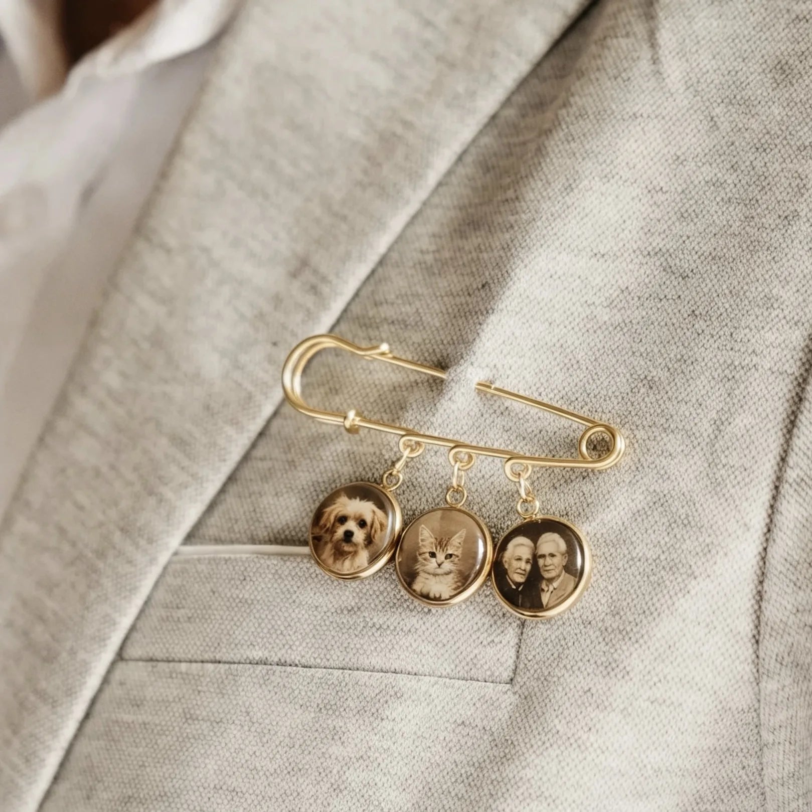 Bride or groom wearing a personalized wedding memory brooch with custom photo charms.